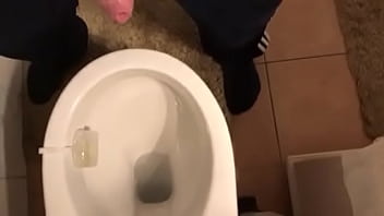Gay man pees in toilet