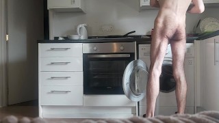 Naked sexy hairy guy making breakfast