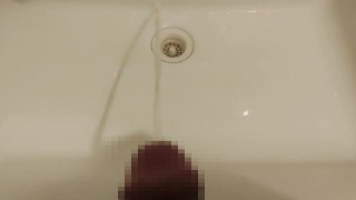 Peeing on the washbasin