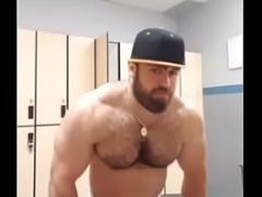 Muscle bear shows off in locker room