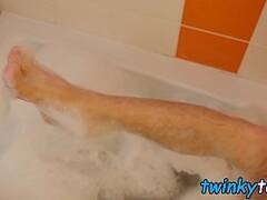 Twink showers and massages his feet before jerking off