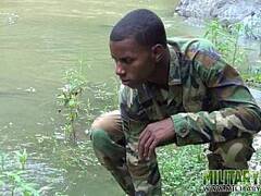 Cockstrong twink soldier by the river