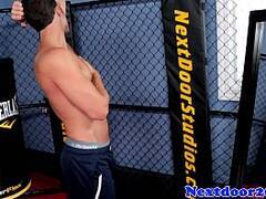 Athletic stud jerking off in a boxing ring