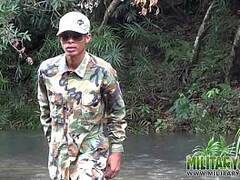 Soldier wades a river for a blowjob