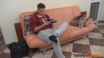 Horny hunk sniffing his feet
