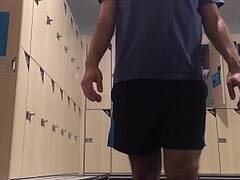 Amateur changing at the gym locker room post workout