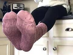 Sissy in socks and leggings playing on the counter