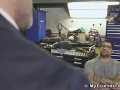 Businessman licks car mechanics feet while teasing big dick