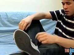 Perverted gay dude rubs his feet and strokes dick solo