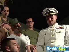 Bearded mature tastes cum after deepthroating young soldiers