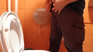 pee in a public orange toilet