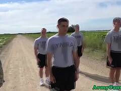 Military hunks stretching asses outdoors