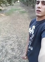 Sexy young guy cums in the orchard